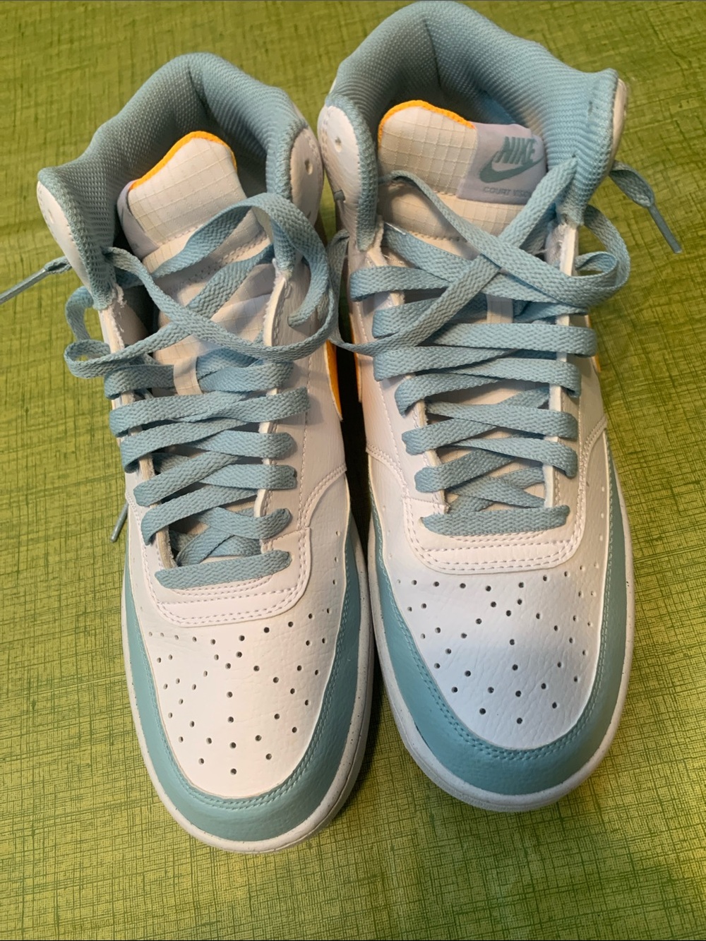 Nike White and Light Blue High-Top Sneakers with Orange Accent